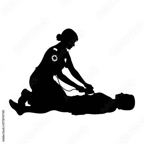 Paramedic administering defibrillator to patient medical