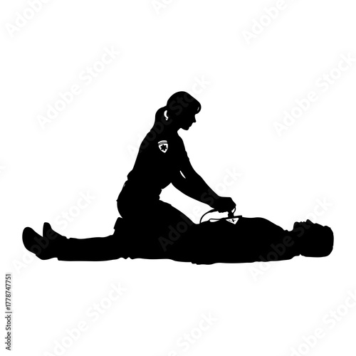 Paramedic administering defibrillator to patient medical