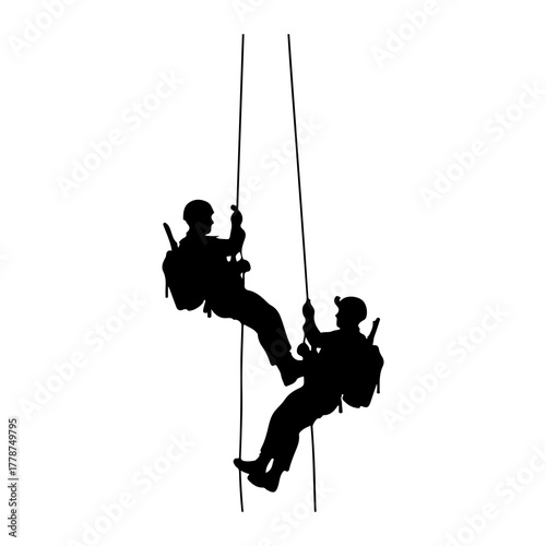 Silhouettes rappelling down ropes people climbing