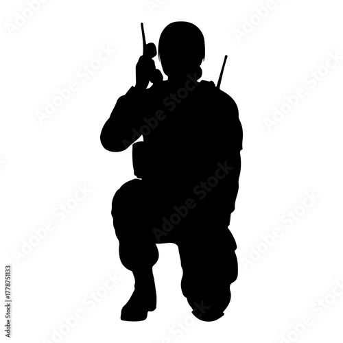 Soldier kneeling talking on radio military communication