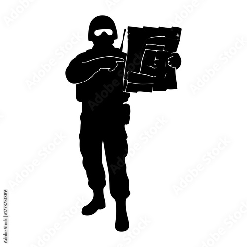 Soldier pointing at tactical map helmet goggles