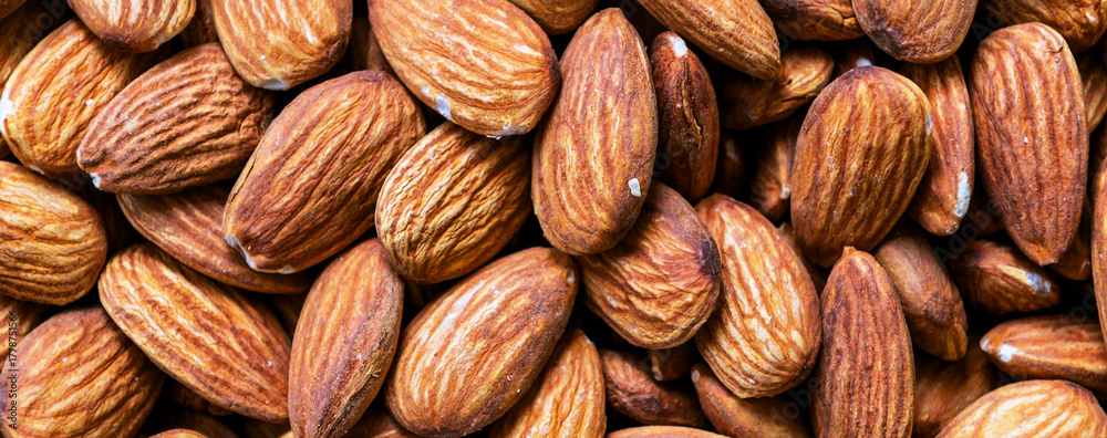 Fototapeta premium Almond. Close up of almond nuts background. Top view