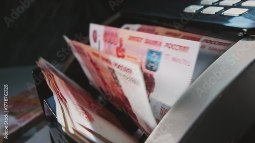 5000 Russian rubles in electronic money counting machine, accounting. Financial transaction in the bank. RUB Mortgage, Seller or broker considers finances. Economic crisis in Russia. Slow motion