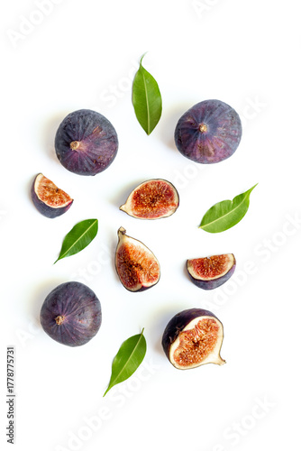 Wallpaper Mural Purple ripe figs fruit and slices with green leaves top view on a white background Torontodigital.ca