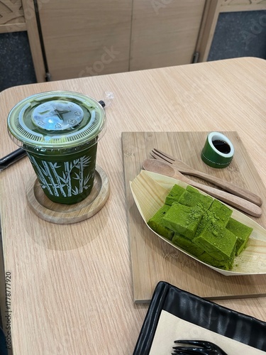 Delicious matcha green tea and sweet dessert in a cafe setting