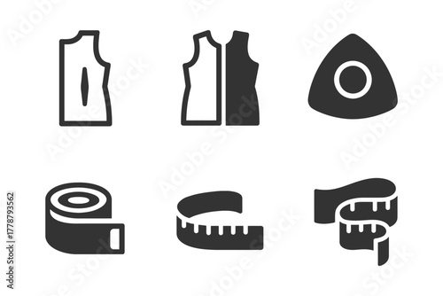 Sewing tools and patterns: dress templates and measuring tapes.