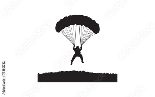 silhouette of a man jumping  and parachute