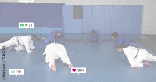 Crawling martial artists wearing training jackets, colored belts across dojo mat with overlay icons