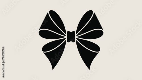 A symmetrical black bow with white outlines on a cream colored background in a simple graphic design