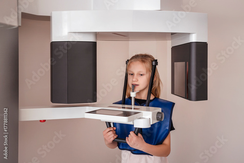 Orthopantomogram Digital image  for Children OPG CT Scan X-Ray. Child Little Girl Make Panoramic single Image Radiograph Mandible, Maxilla and Teeth. 