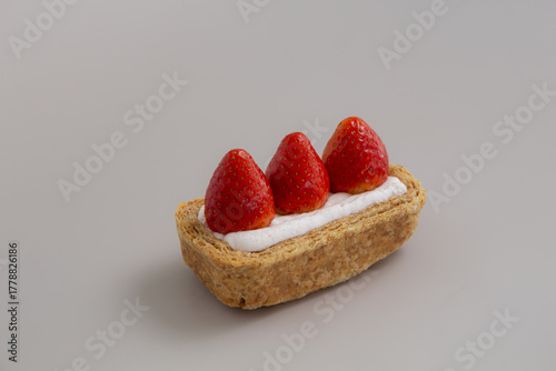 Strawberry flaky pie, Sweet dessert from Korea on grey background.