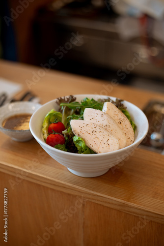 Fresh green salad with chicken breast and Tomato.