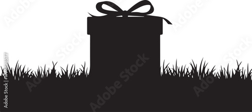 Black silhouette of a gift box with bow on grass gift box silhouette