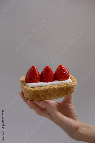 Strawberry flaky pie, Sweet dessert from Korea on grey background.