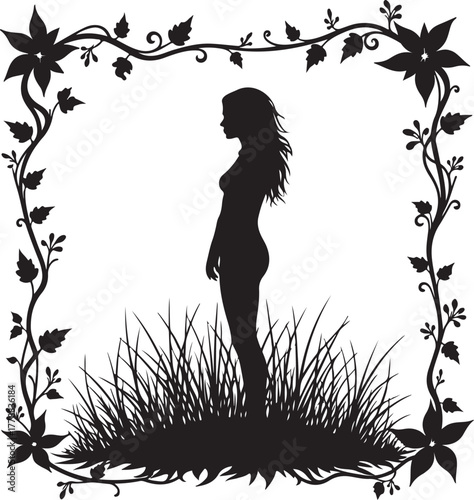 Black silhouette of woman standing in grass framed by floral vines