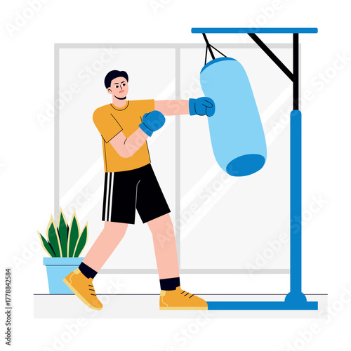 Boy doing punching practice using punching bag