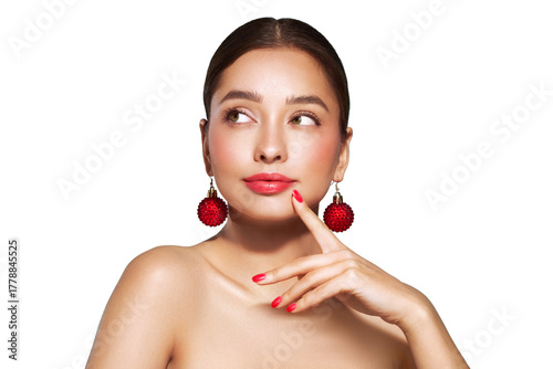 Portrait of beautiful young woman on transparent background, red lipstick and festive makeup, Christmas toy earrings, shiny glowing skin, Winter holidays concept