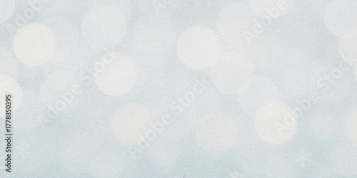 Abstract background texture with speckled patterns and subtle color variations suggesting a soft hazy atmosphere and wintery light