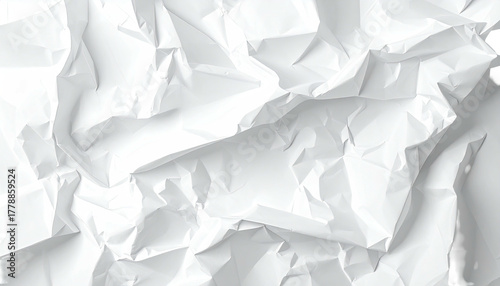 Crumpled white paper creating chaotic folds and sharp angles