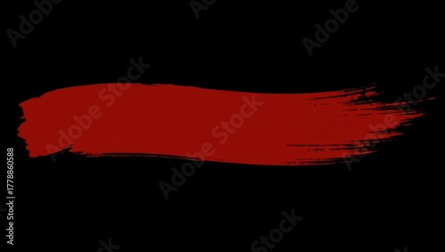 Bold red paint brush stroke on a stark black background