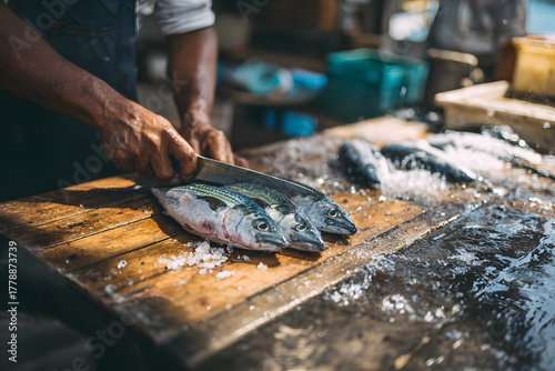 Expert fishmonger prepares fresh catch at busy market during morning hours