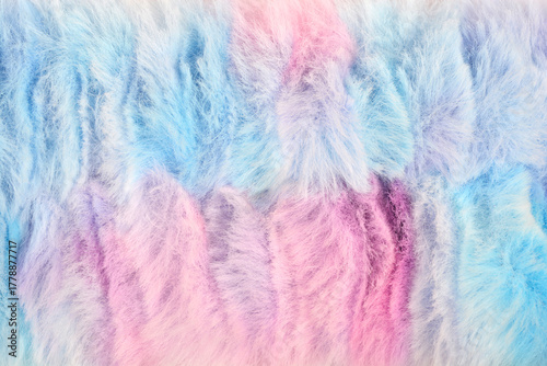 A full frame, overhead shot of a colorful, fluffy, pastel pink and blue faux fur texture