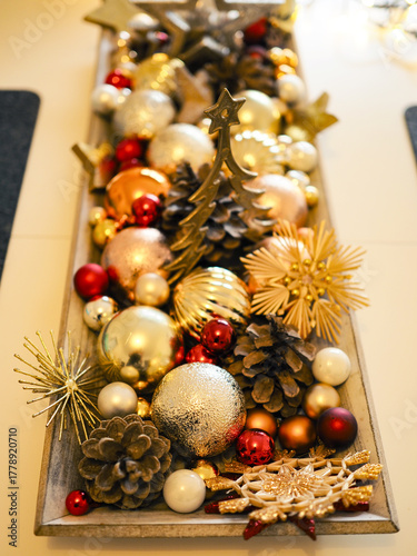 Festive Christmas decorations on a white table, selective focus on foreground