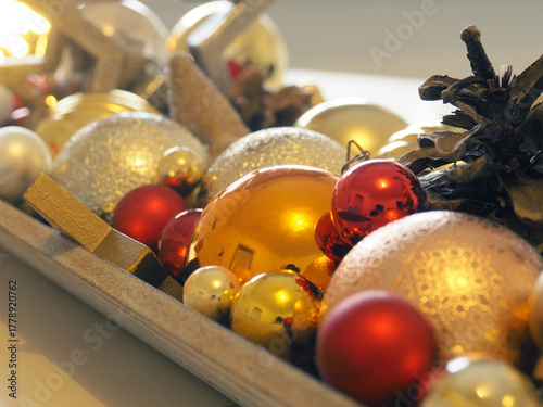 Festive Christmas decorations on a white table, selective focus on foreground