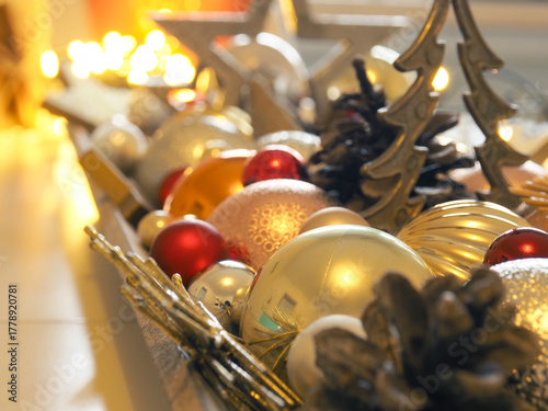 Festive Christmas decorations on a white table, selective focus on foreground
