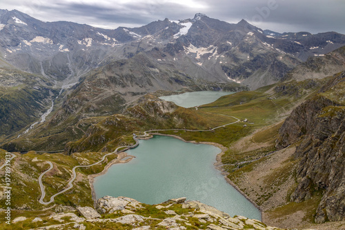 View from the Nivolet hill, the Alpine pass in the Graian Alps from Piedmont and Aosta Valley in the Gran Paradiso National Park with Agnel and Serrù lakes, Italy