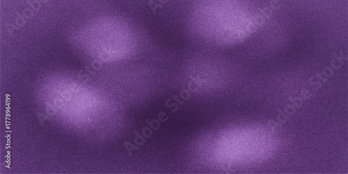 Abstract bokeh lights in shades of deep purple and lavender creating a dreamy and ethereal background texture