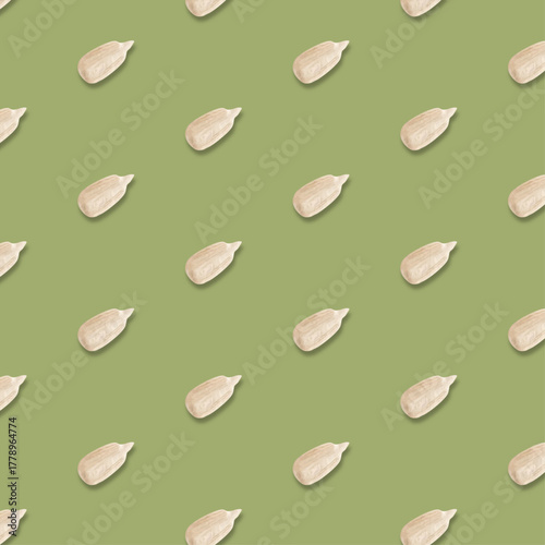 Realistic peeled sunflower seeds, seamless vector pattern on green background	