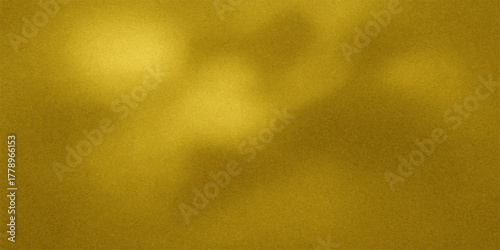 Abstract textured golden background with soft light and subtle shadows creating a luxurious and elegant feel