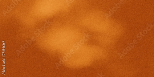 Warm abstract background with soft focus and glowing light effects in shades of orange and brown