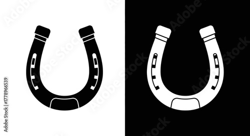 A simple graphic illustration of a horseshoe icon presented in two contrasting versions, black on a white background and white on a black background.