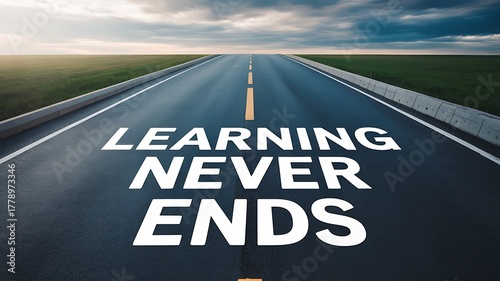 Learning never ends written on road, concept of lifelong learning and education