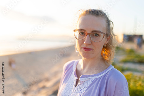 Young woman enjoying sunset on a beach vacation