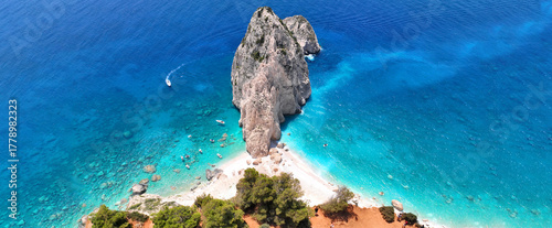 Aerial drone ultra wide panoramic photo of scenic small islet of Mizithres in Keri area forming double turquoise sandy beaches a true paradise for small boats, Zakinthos island, Ionian, Greece