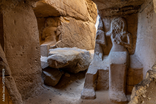 Interior of Ancient Rock-Cut Shrine with Weathered Statues at Gebel el Silsila