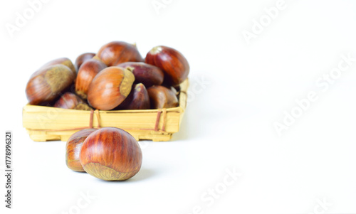 chestnuts in a basket and white background