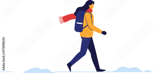 Woman walking in snowy landscape wearing a yellow coat and scarf  