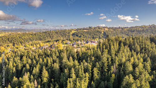 Fototapeta Naklejka Na Ścianę i Meble -  Mountain Valley with Village and Forest, Aerial View in Poland