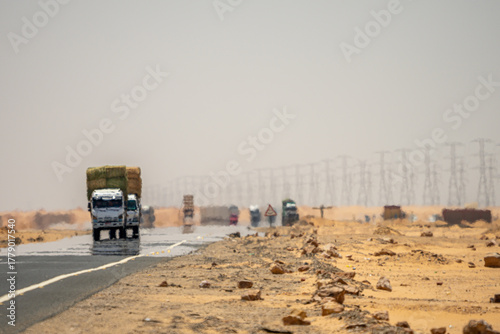 Truck driving through desert highway to Abu Simbel, Egypt