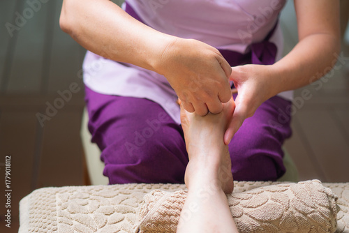 Close-up of professional foot reflexology massage for wellness.