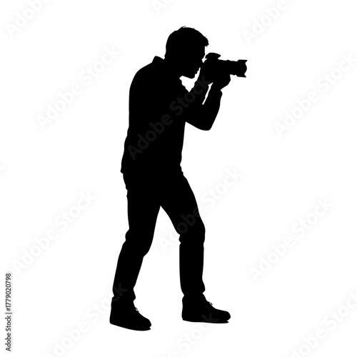 Silhouette of a photographer holding a camera and taking a picture against a white background