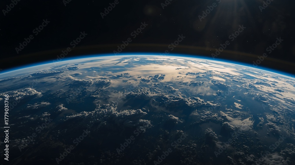 Fototapeta premium Stunning view of planet Earth illuminated by sunlight from outer space.