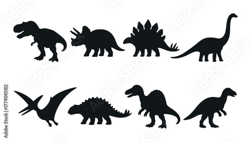 Silhouettes of prehistoric dinosaurs on dark background