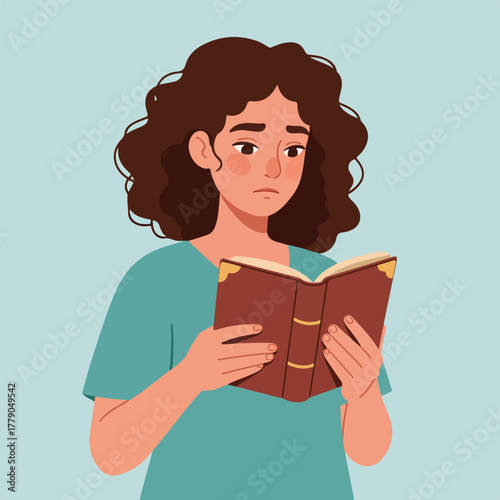 A woman with curly brown hair gazes thoughtfully at a book in her hands. She wears a teal shirt, against a pale blue backdrop