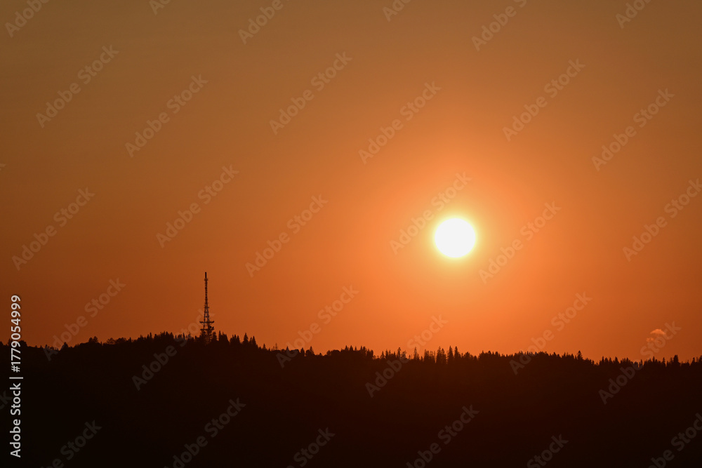 Fototapeta premium Scenic sunset over Gubalowka, Zakopane, Poland. View of the slope of Gubalowka with its characteristic tower - The Zakopane-Gubałowka transmitter, a facility for FM and TV transmission