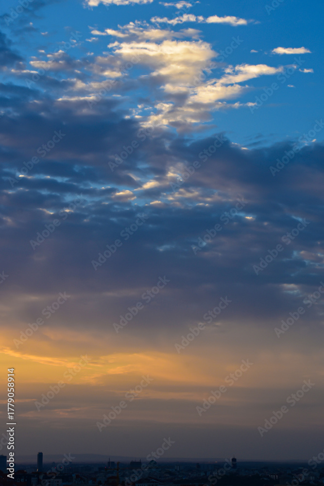 Fototapeta premium Sunset Glow Over Quiet Urban Horizon